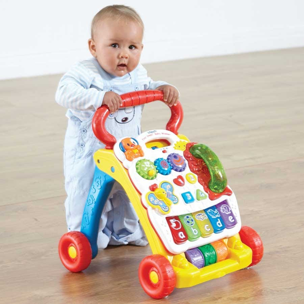 Подарок на первые шаги. Ходунки каталка Vtech. Ходунки Walker Baby толкалка. Ходунки Vtech "первые шаги". Vtech 505603 Baby Walker.